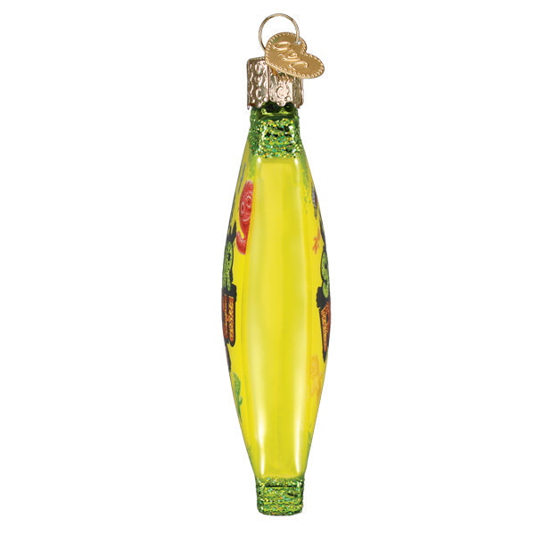 Side view of a yellow glass Sour Patch Kids ornament with green glitter accents and a gold cap.