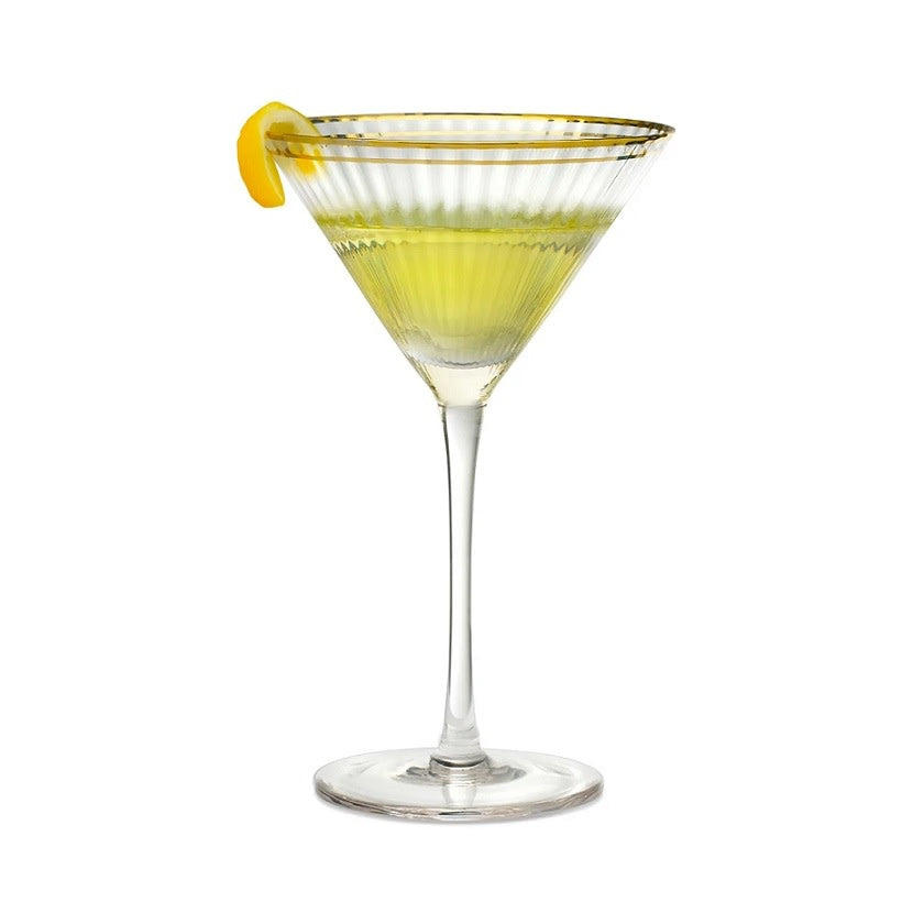 Translucent glass martini glass with a gold band around the rim