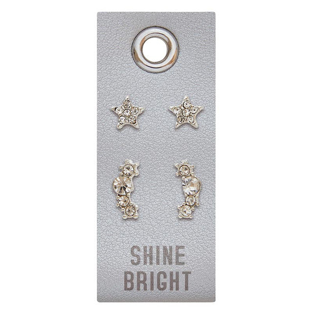 Silver stud earrings featuring a PU leather tag with rhinestone accents.