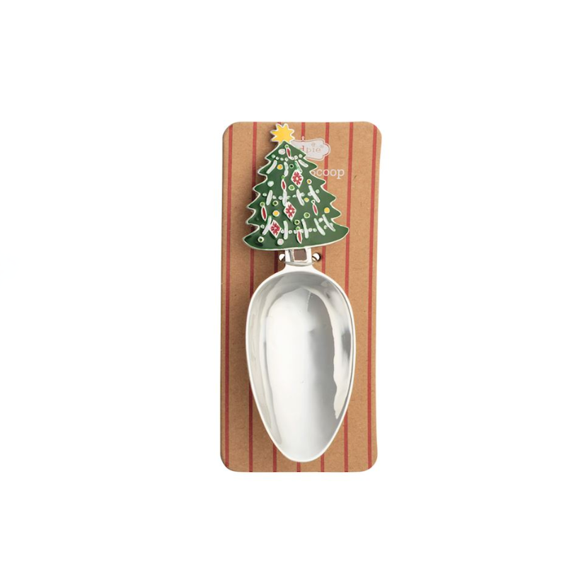 Stainless steel Christmas candy scoop with a green enamel Christmas tree handle on a display card.