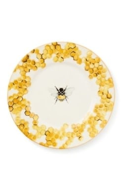 Handmade stoneware Queen Bee dinner plate with a yellow bee pattern on white.