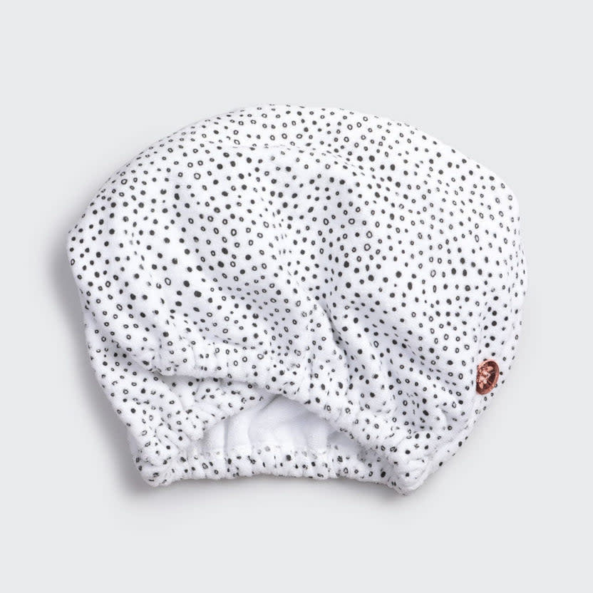 Quick dry hair towel in micro-dot pattern made from organic cotton and bamboo with stretch elastic trim.