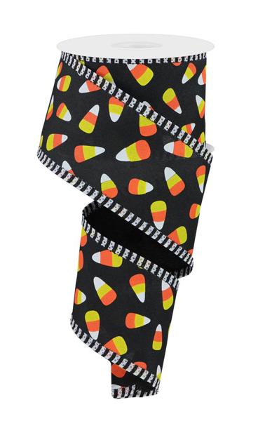 2.5 inch black ribbon with mini candy corn pattern and black and white striped edges.