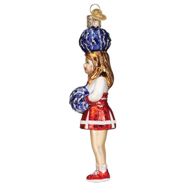 Glass cheerleader ornament in a red and white uniform holding blue pom-poms.