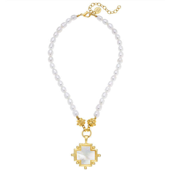 Mother of Pearl cross pendant on a white pearl necklace with gold-tone accents and clasp.