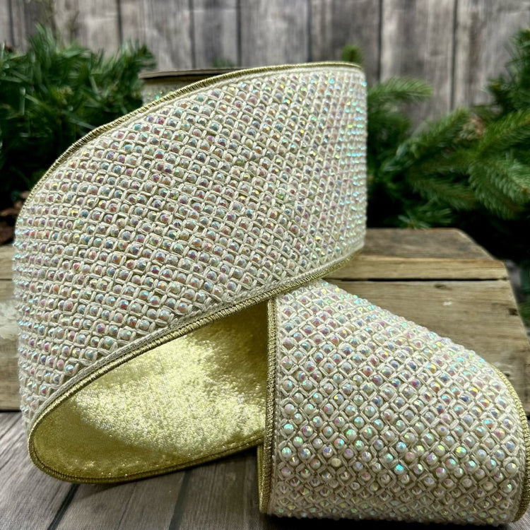 4 inch wide vanilla metallic dupion ribbon with iridescent jewel macrame and gold wired edges.