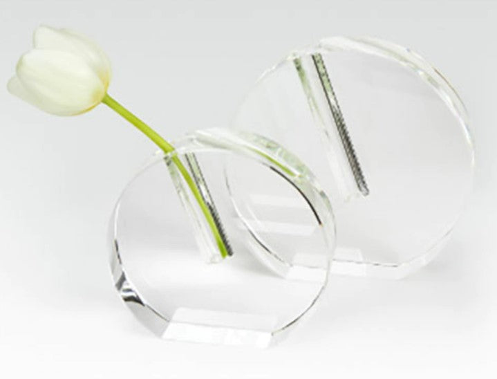 Small round flat crystal glass bud vase with a clear finish