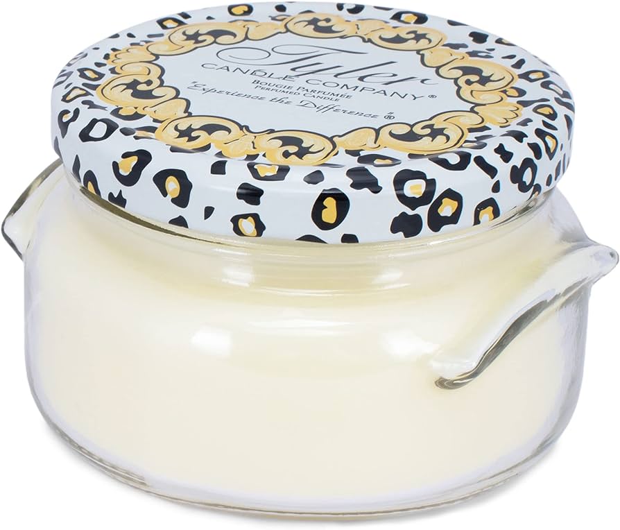11oz Tyler Candle in a clear glass jar with a leopard print and gold patterned lid.