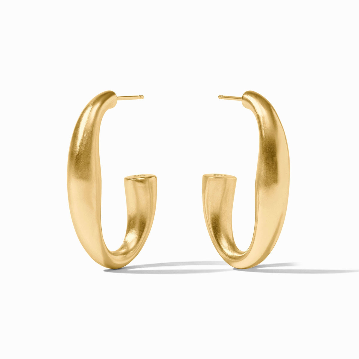Gold hoop earrings with a brushed finish and a unique, curved silhouette.