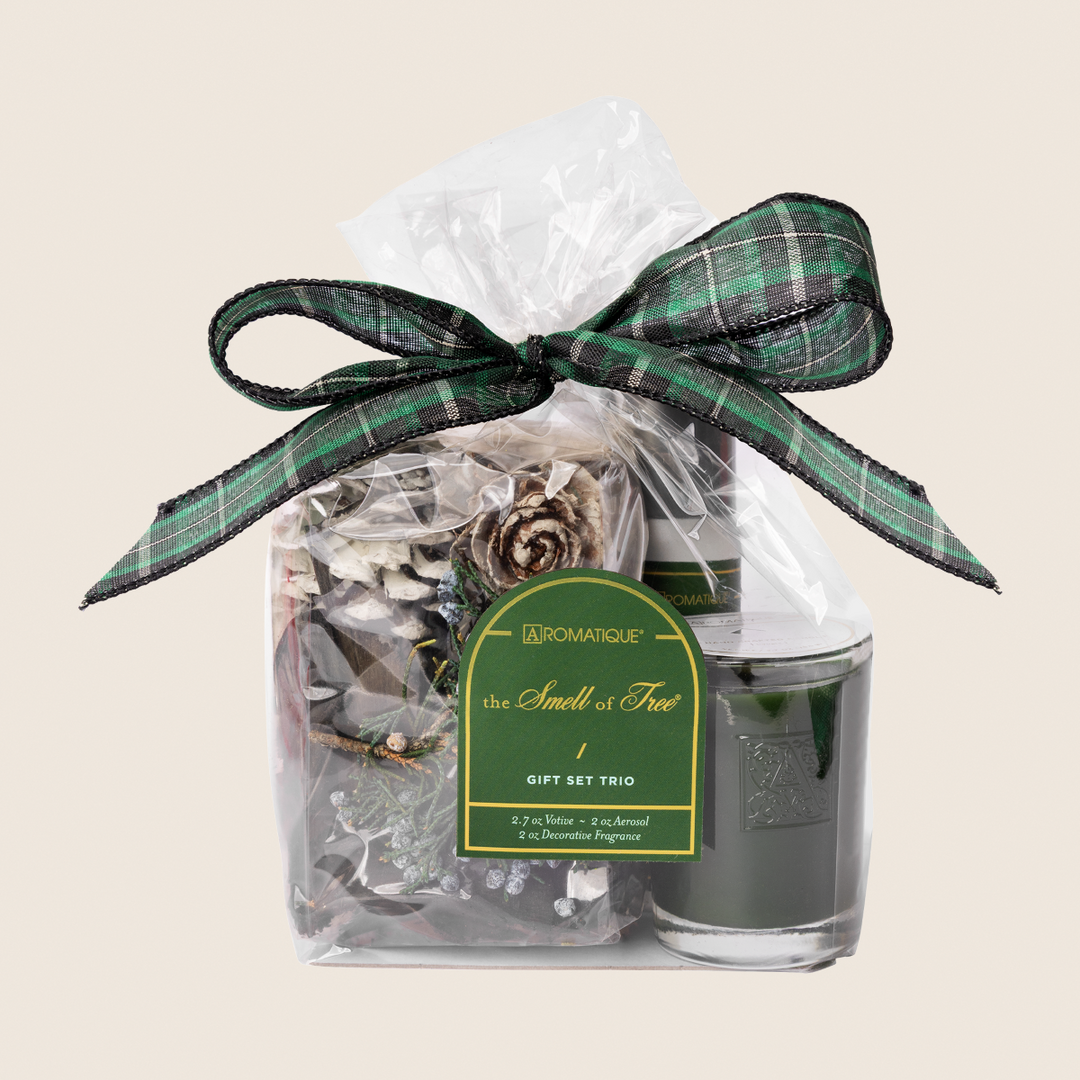 The Smell of Tree Gift Set Trio with potpourri, room spray, and a green votive candle in a gift bag.