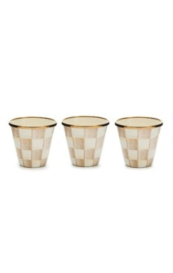 Three mocha and cream checkered herb pots with gold rims arranged in a row.