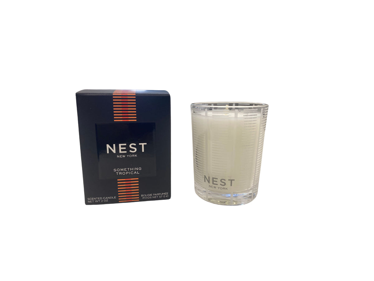 Nest Votive Candle in a clear glass holder with white wax.