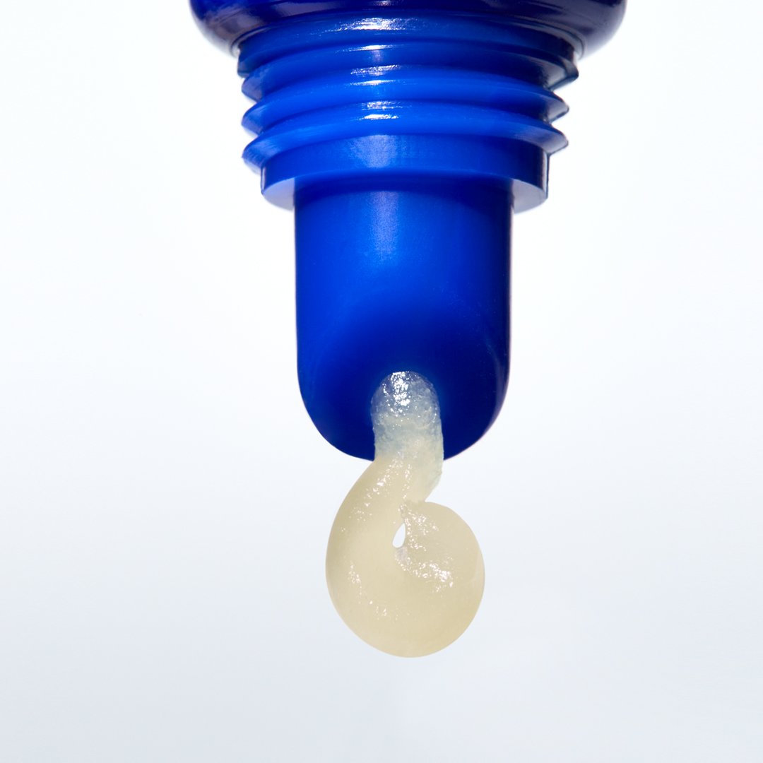 Intense Therapy Lip Balm SPF 25 in lemon-colored tube with shea butter and avobenzone protection.