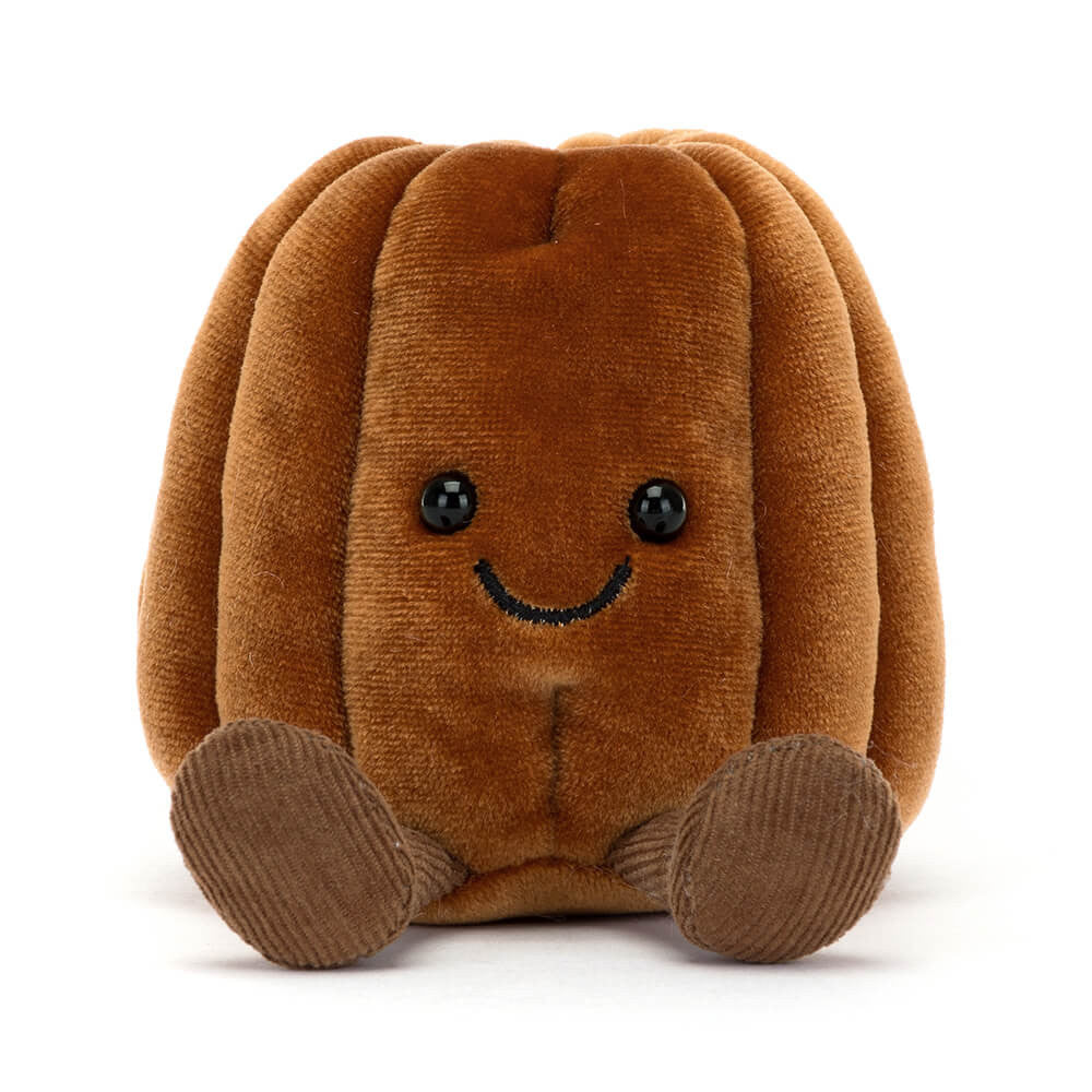 Amuseables Carole Canelé doll with a soft polyester body in beige tones and detailed facial features.