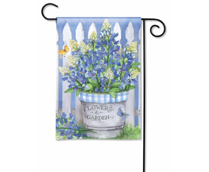 Garden flag with bluebonnets in a pot, white picket fence, and butterflies.