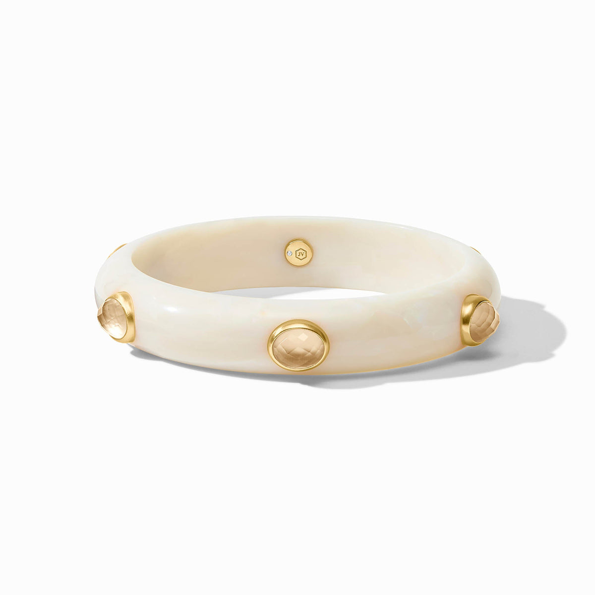 Sleek Carnaby Stone bangle in gold-plated acetate with imported glass accents.