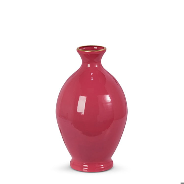 Pink iron vase with a cylindrical shape measuring six inches wide by ten inches tall.