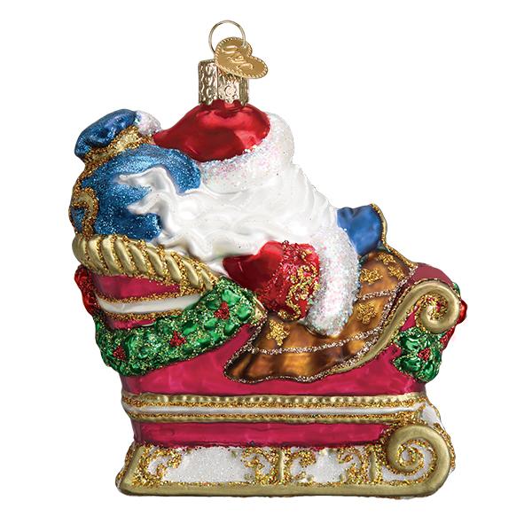 Glass Santa in Sleigh ornament with red, gold, and green glitter accents.