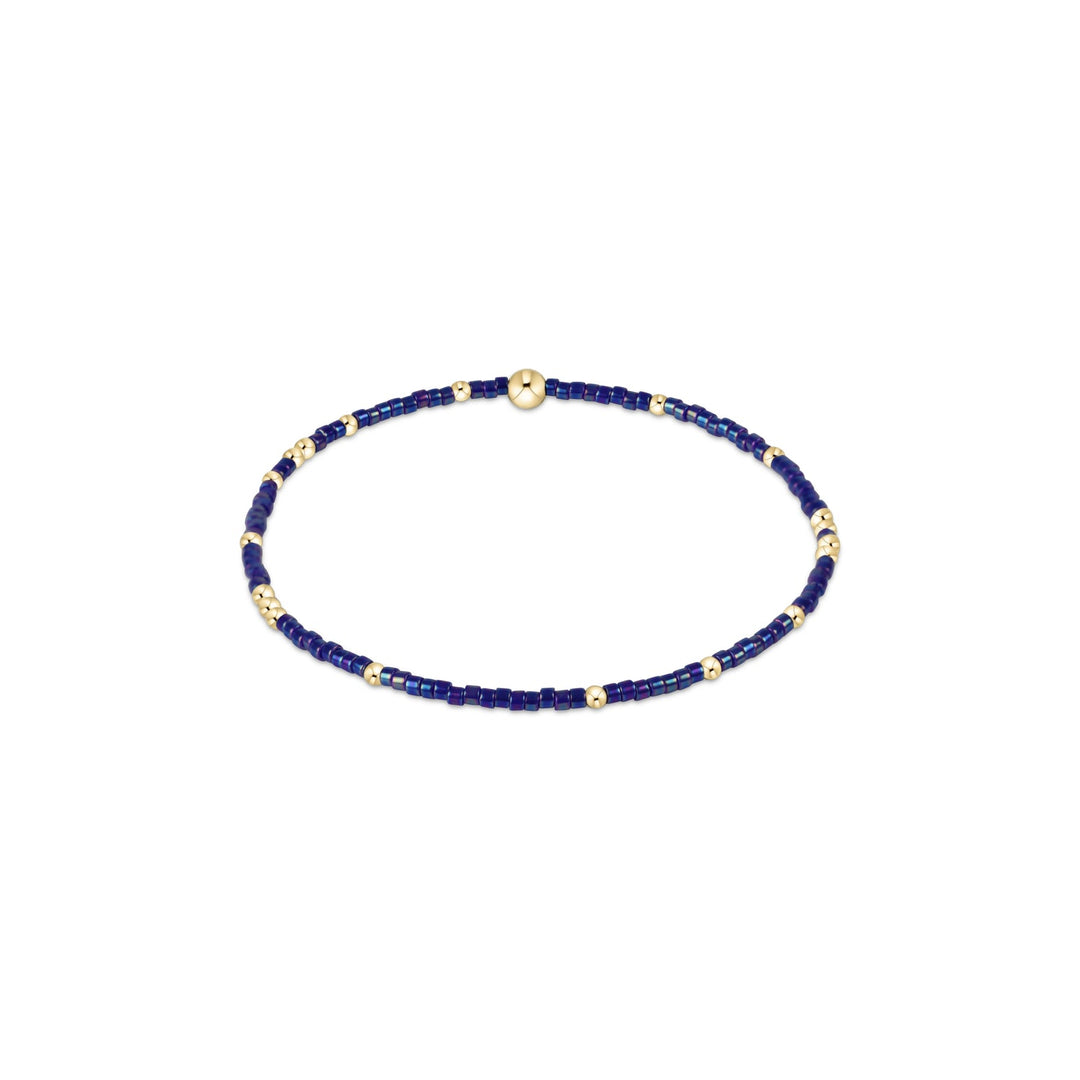 Egirl Hope Unwritten bracelet featuring 14kt gold-filled beads with multicolored seed bead accents on stretch elastic.