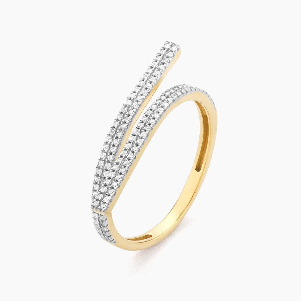 Give & Receive statement ring featuring a central diamond on a polished gold band with an open silhouette design.