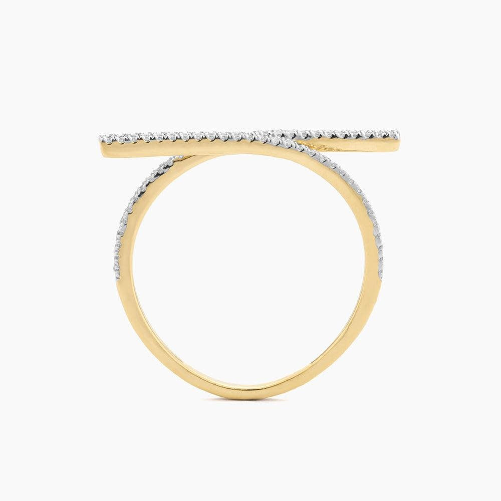Give & Receive statement ring featuring a central diamond surrounded by smaller stones in an ornate gold setting.