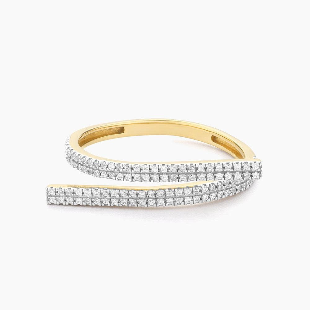 Give & Receive statement ring featuring a central diamond on an ornate gold band with intricate filigree detailing.