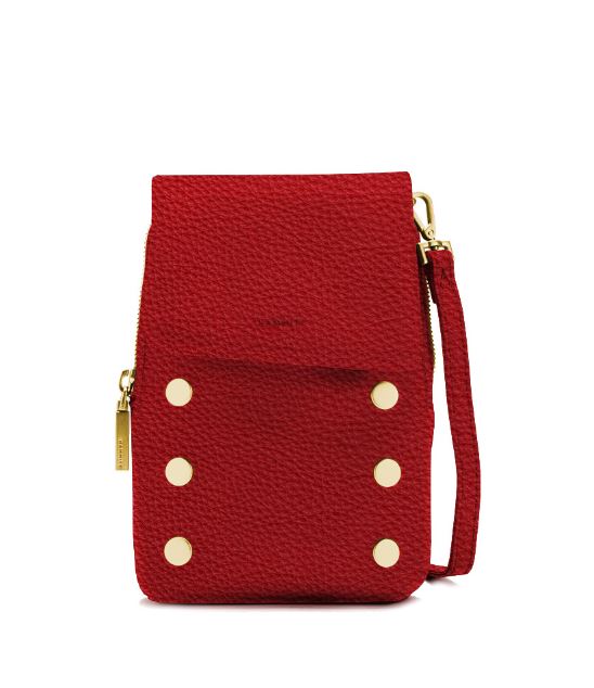 Red leather crossbody phone bag with gold hardware and six decorative studs on the front.