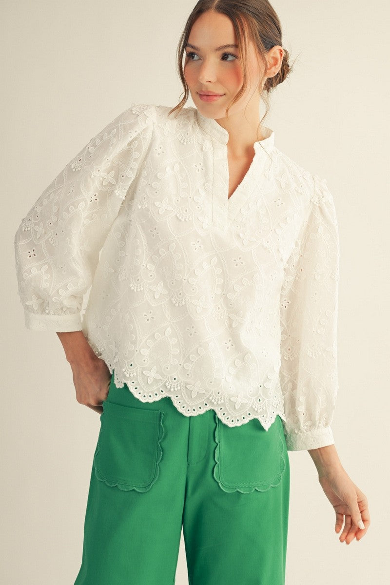 Ariana Scallop Hem top in white cotton with v-neck, three-quarter sleeves, and scalloped lace hem.