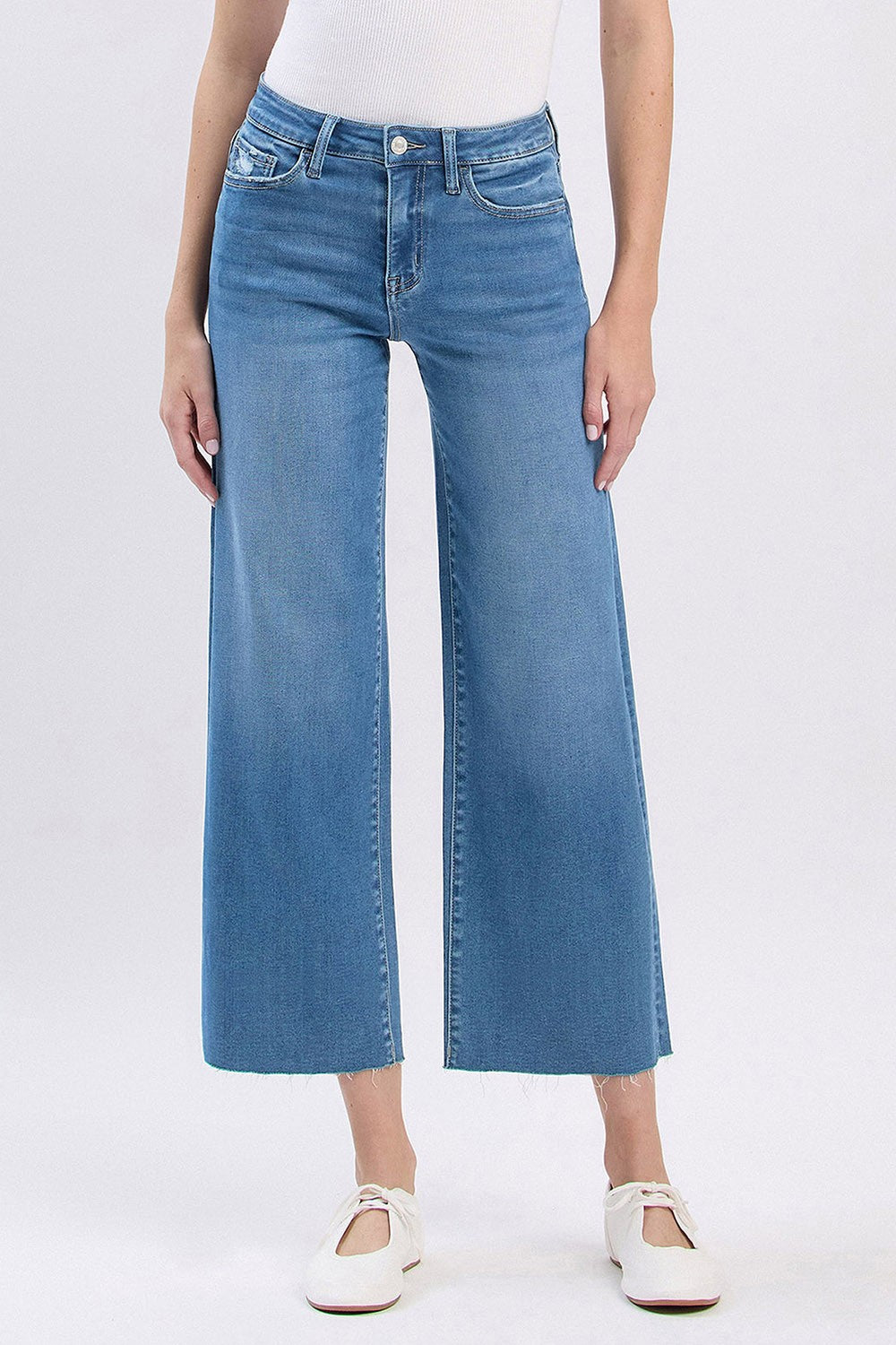 Audrey high rise cropped slim wide leg jeans in light wash denim with a raw hem.