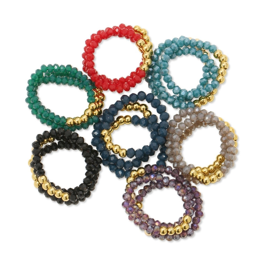 Stretch crystal ring with bead accents on an 18k gold plated brass base.
