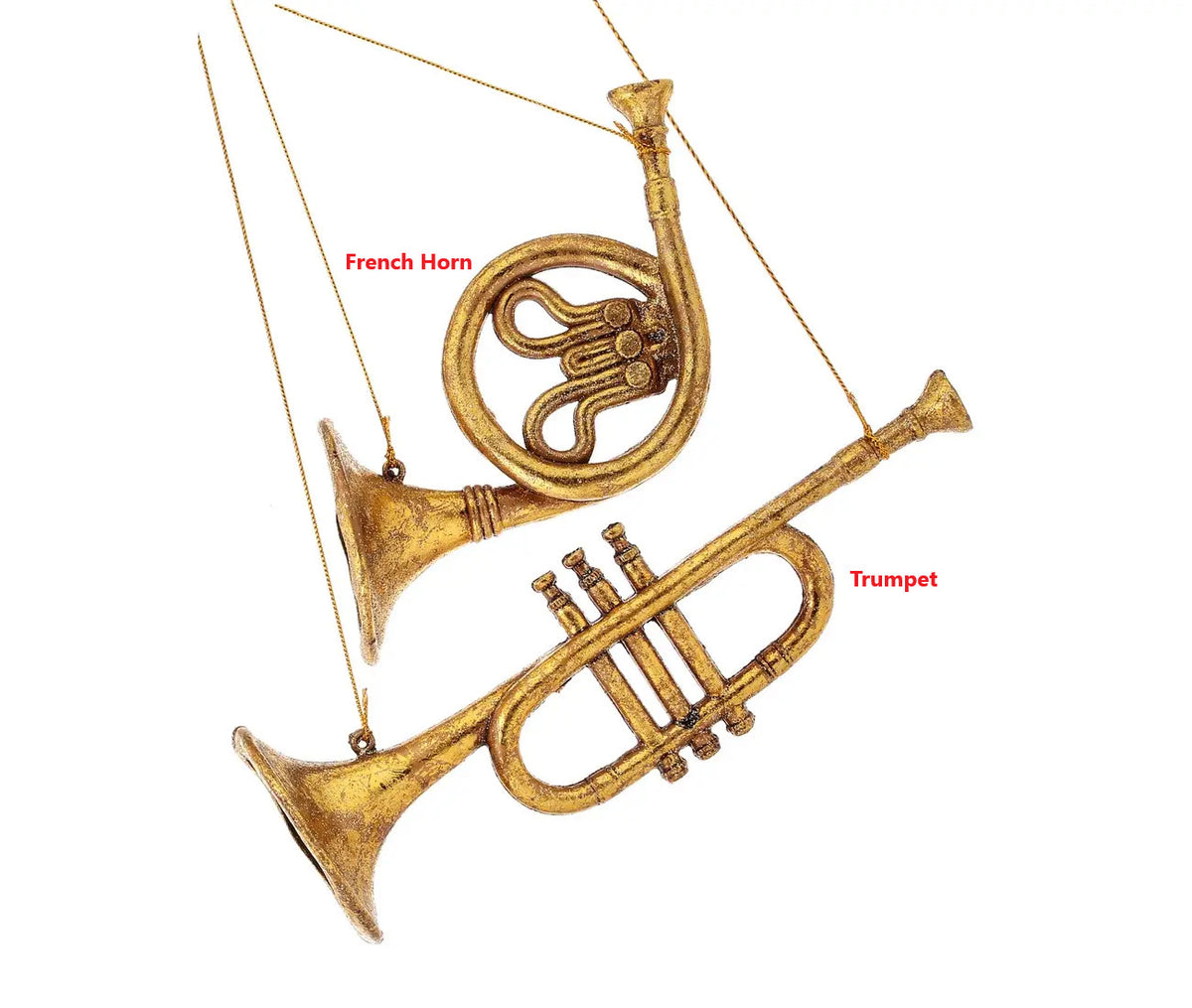 Gilded plastic musical instrument ornaments in French horn and trumpet styles with gold hanging strings.