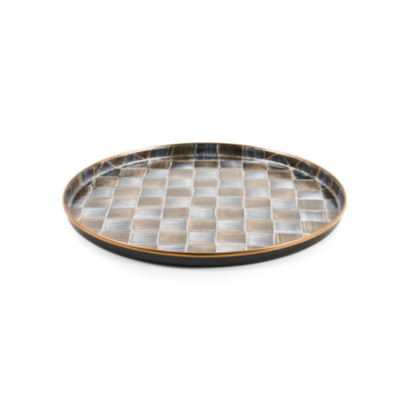 Round decorative tray with a metallic gold and silver checkered pattern and a black outer rim.