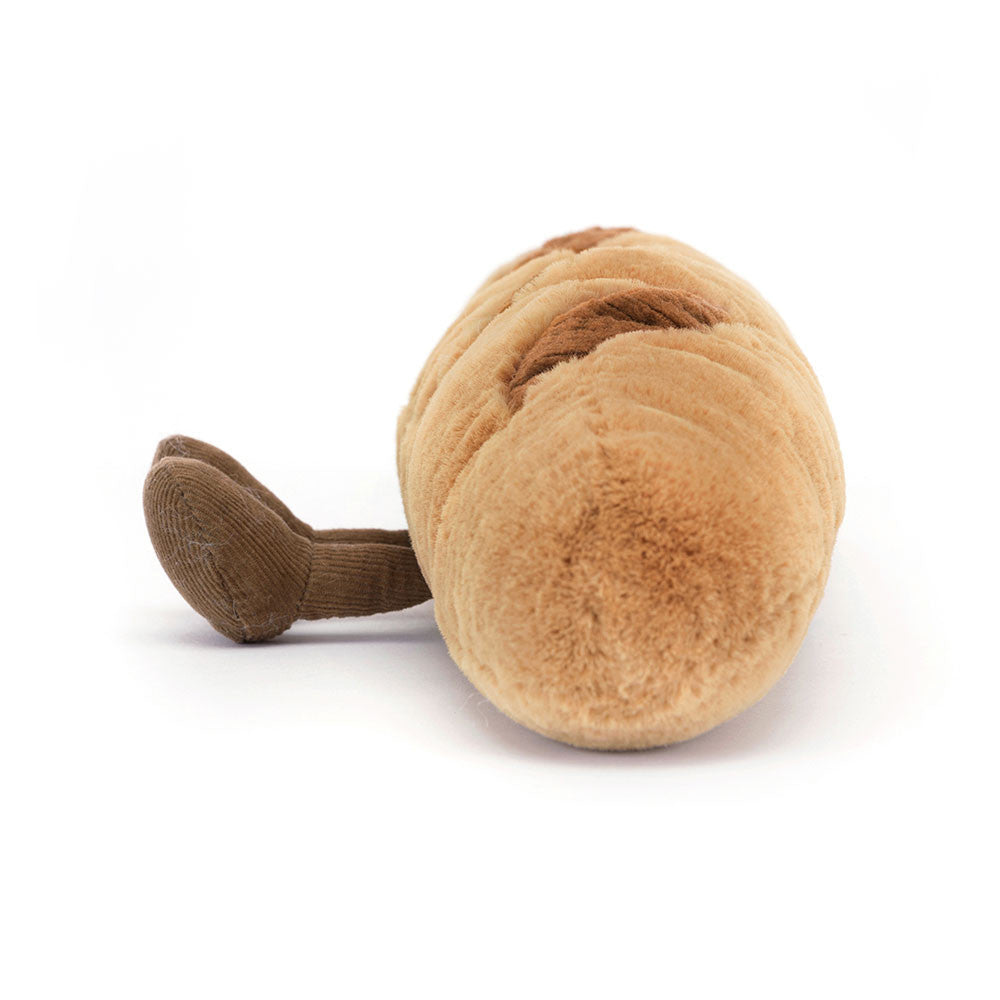 Side view of a plush Amuseables Baguette with brown corduroy legs and a soft, textured body.
