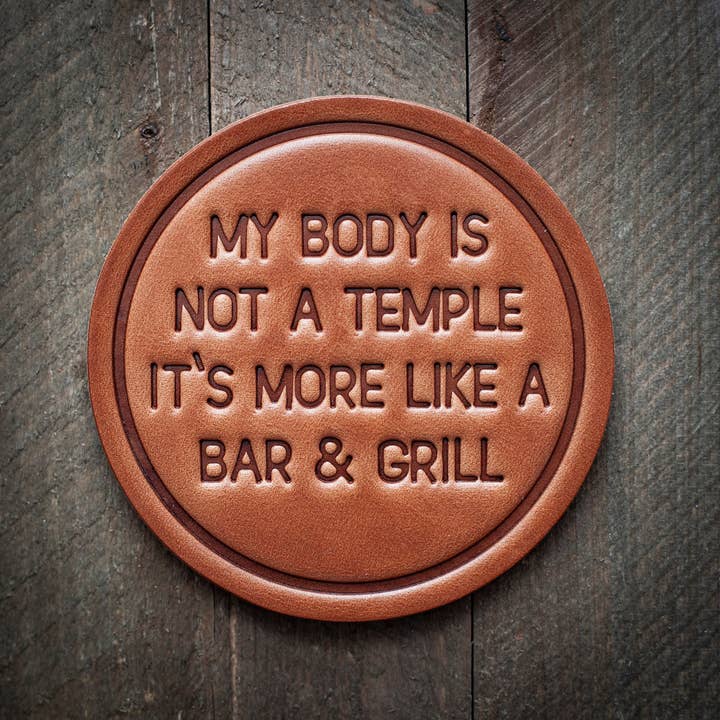 Square leather coaster with a natural patina finish.