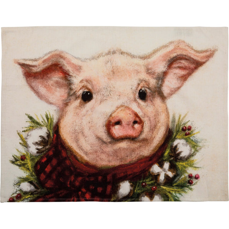 Red holiday dish towel with white snowflake patterns on a folded rectangular shape.