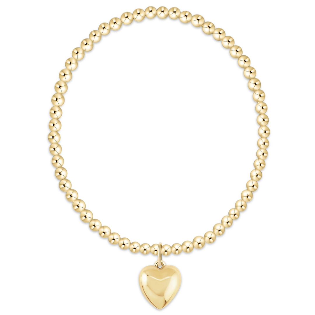 Classic gold 3mm beaded stretch bracelet featuring a 14kt gold-filled heart-shaped charm.