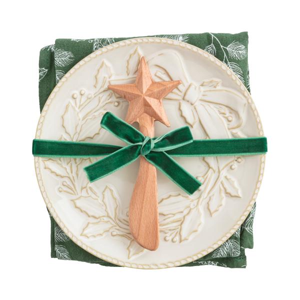 White milk glazed stoneware Christmas appetizer plate set with textured relief pattern.
