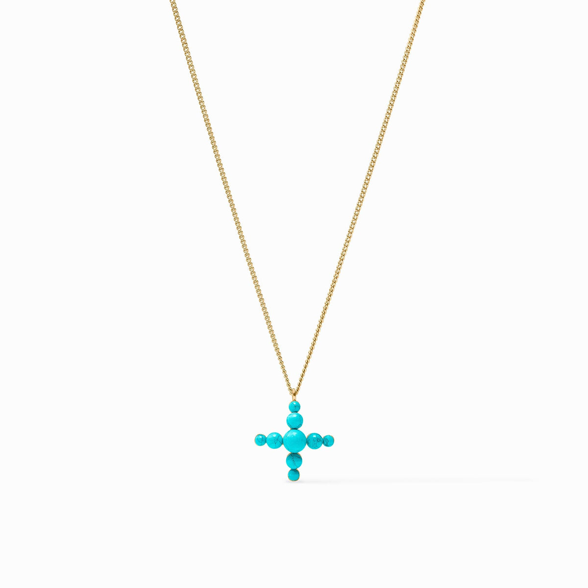 Gumdrop Cross Delicate Necklace with a gold chain and turquoise stone cross pendant.