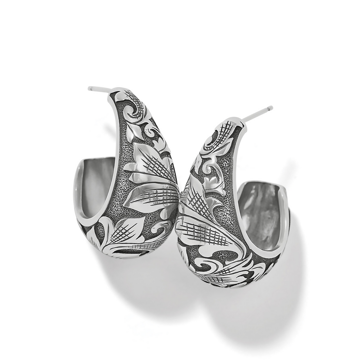 Ferrara Florentine silver hoop earrings with intricate floral and scrollwork engravings.