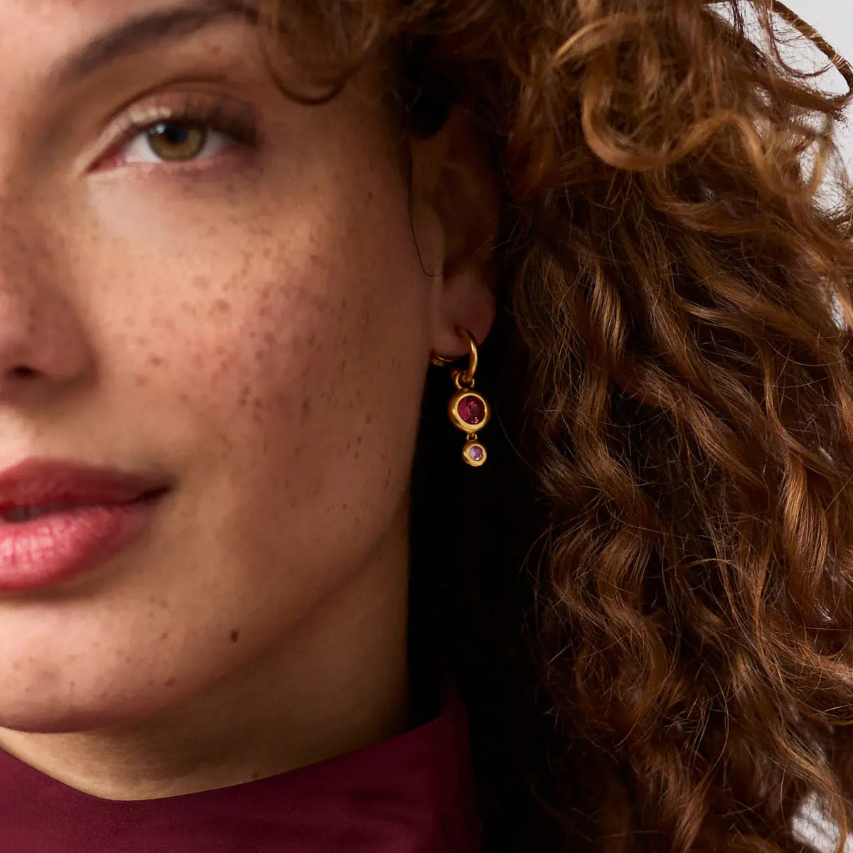 Rainbow Duo hoop earring with two colorful charms on gold-plated posts