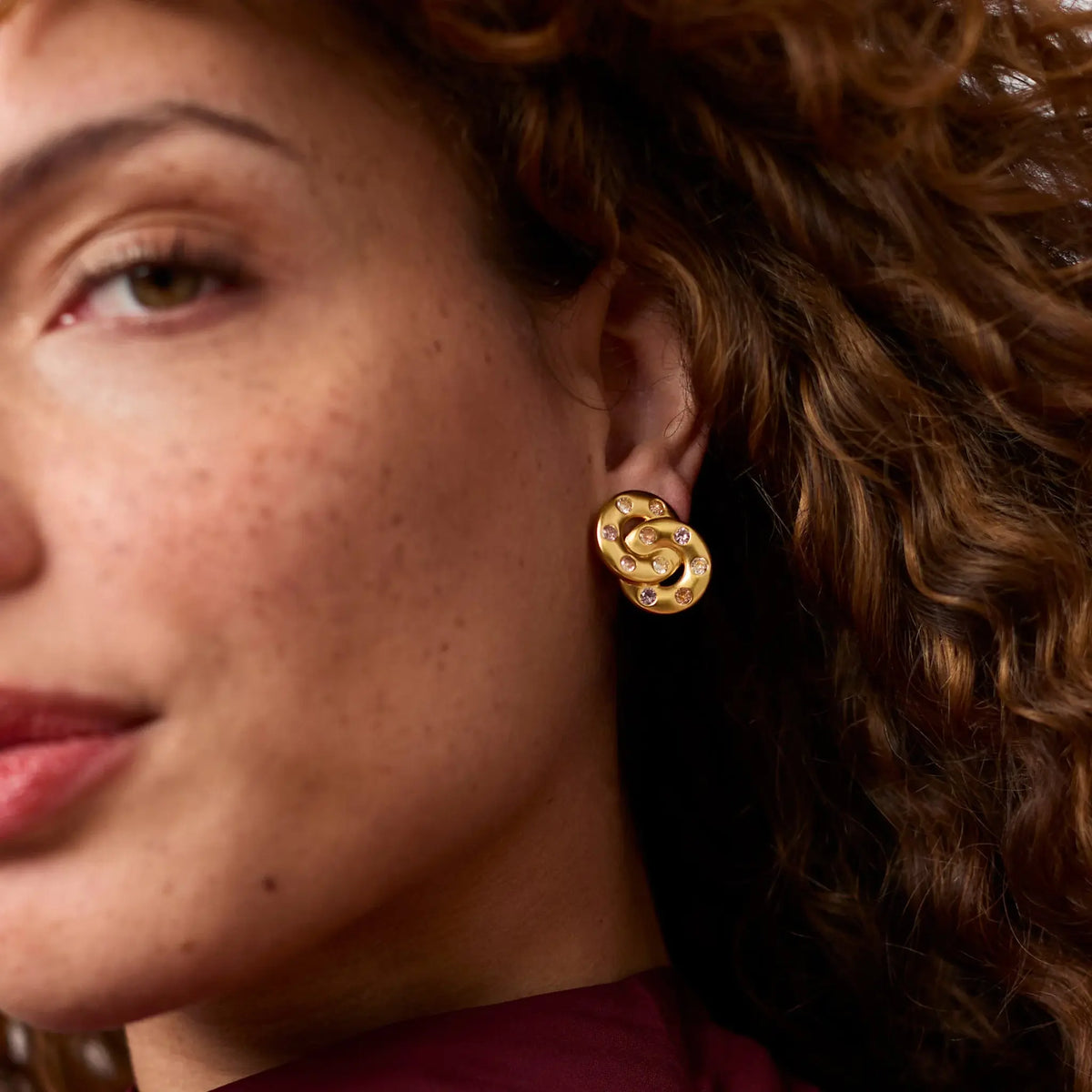 Rainbow infinity earring with gold plating and cubic zirconia stones