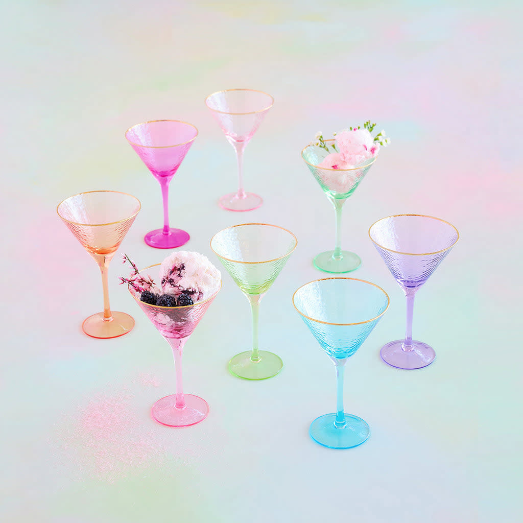 Hand-blown rainbow martini glass with transparent colorful body, gold accents, and festive shimmering design.