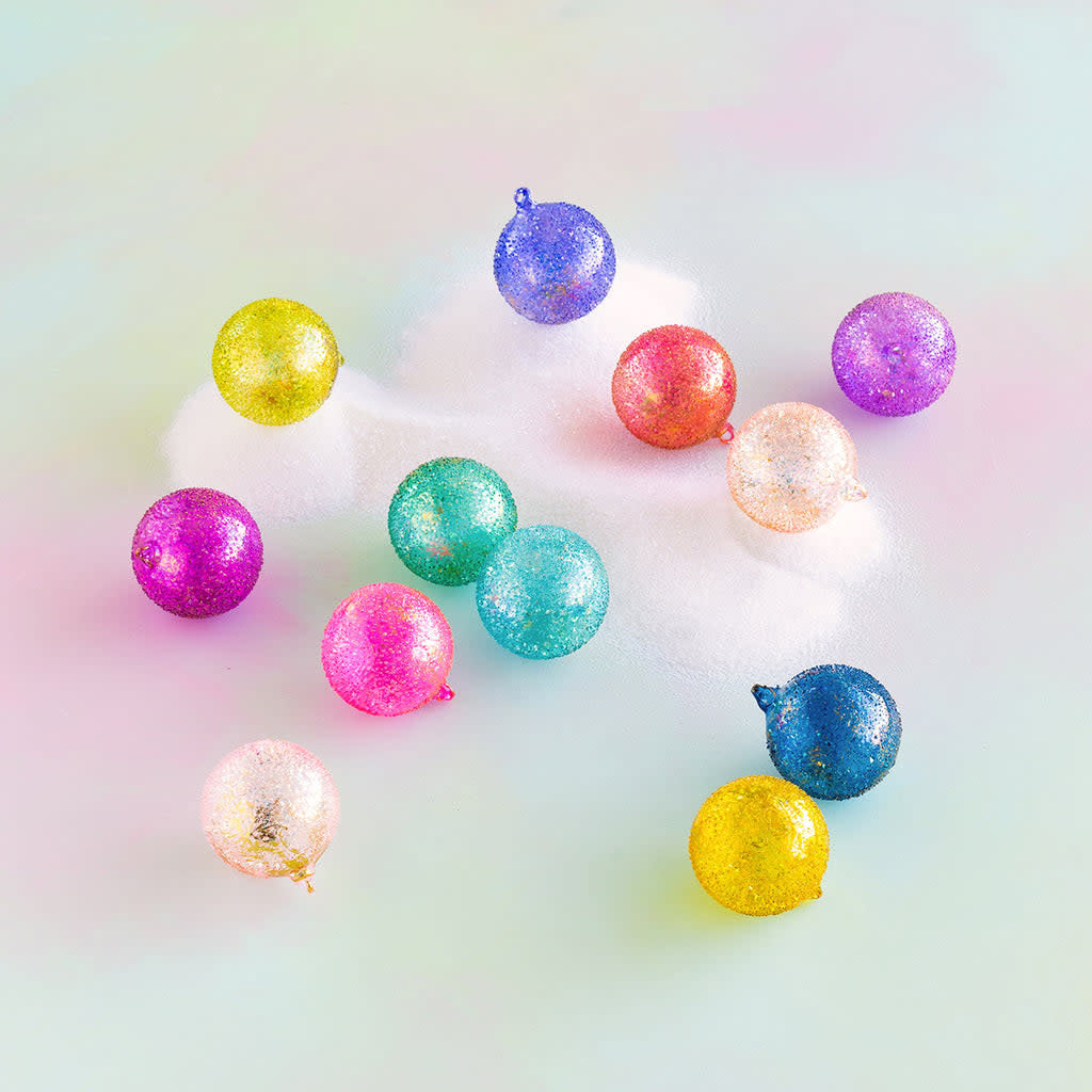 Hand-blown glass rainbow sparkle ball ornament with glittered finish