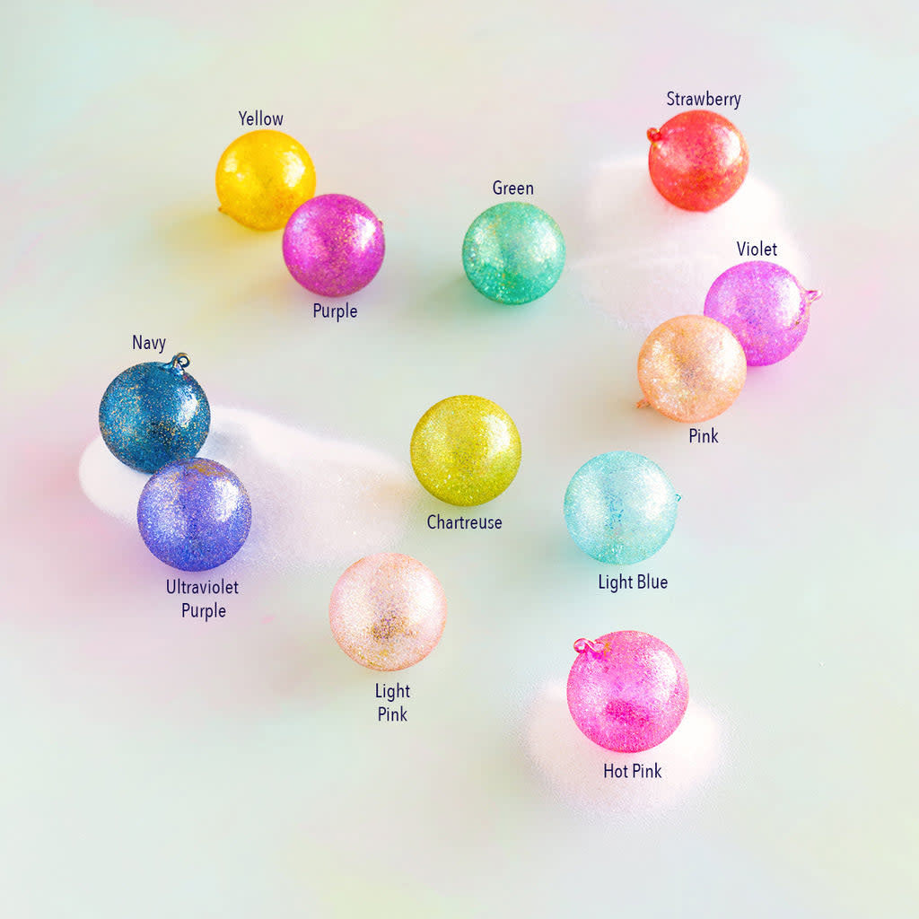 Hand-blown glass rainbow stubble ball ornament with vibrant multicolored speckled pattern.