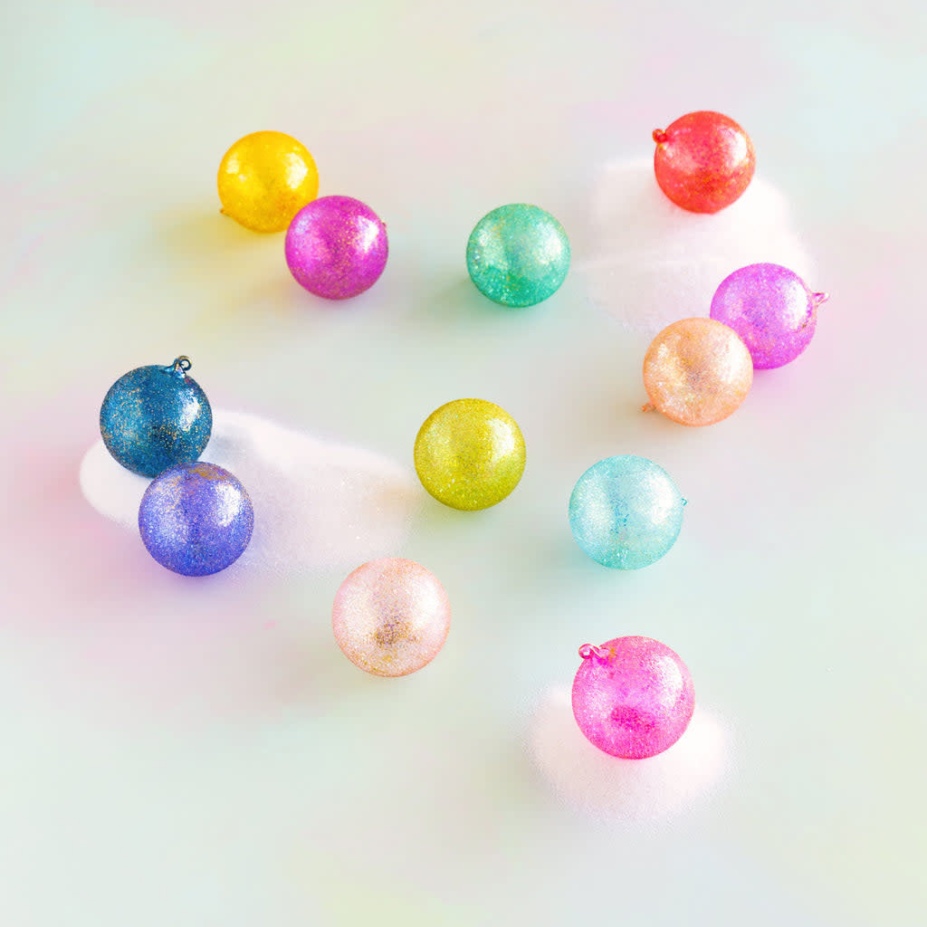 Hand-blown glass rainbow stubble ball ornament with vibrant multicolored speckled pattern.