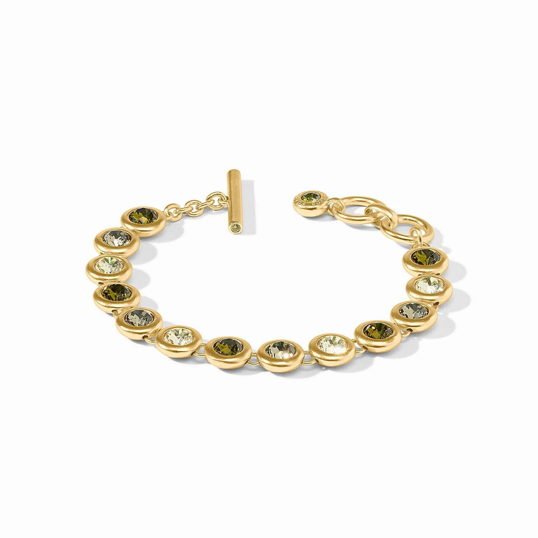 Adjustable rainbow tennis bracelet with gold plating, glass stones, and a toggle clasp.