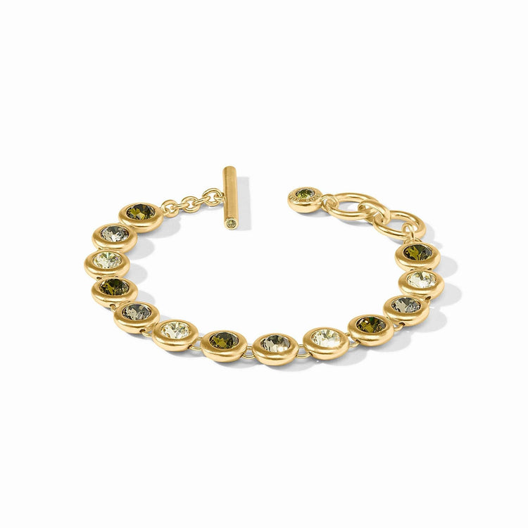 Adjustable rainbow tennis bracelet with gold plating, glass stones, and a toggle clasp.