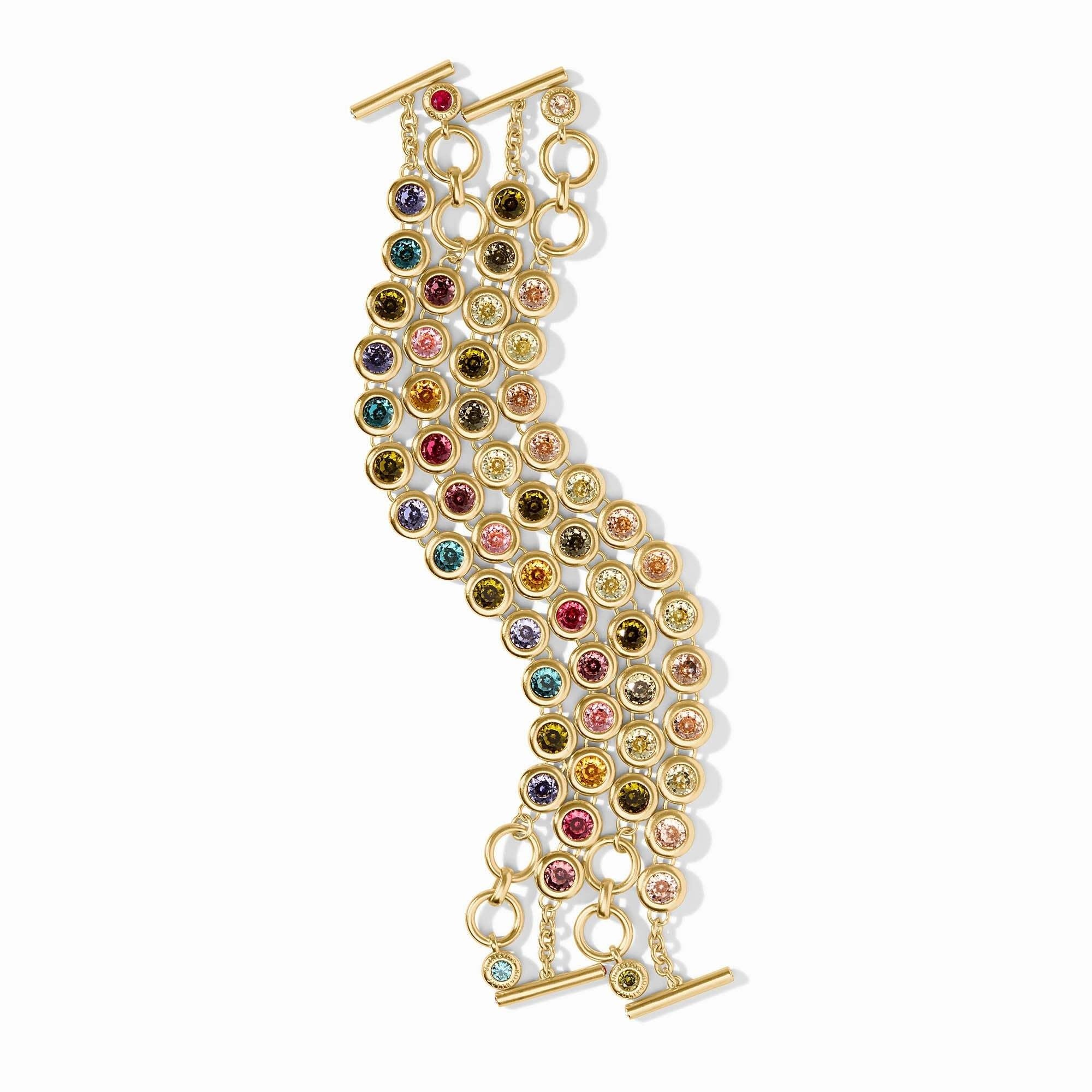 Adjustable rainbow tennis bracelet with toggle clasp featuring imported glass beads on a gold plate chain.