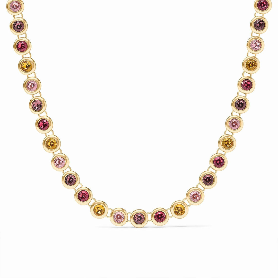 Adjustable rainbow tennis necklace with vibrant multicolored stones set in a polished gold plate chain.