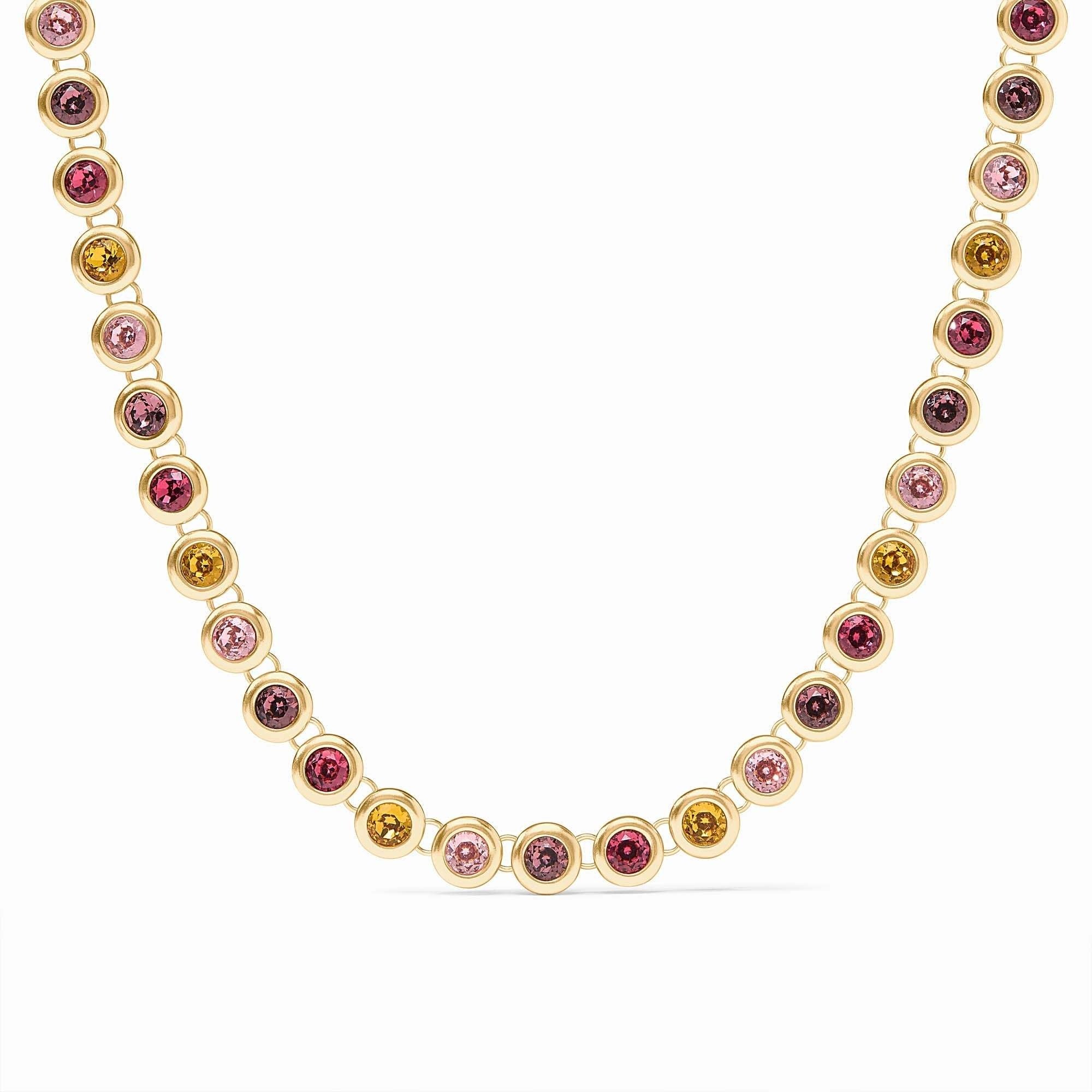 Adjustable rainbow tennis necklace with vibrant multicolored stones set in a polished gold plate chain.